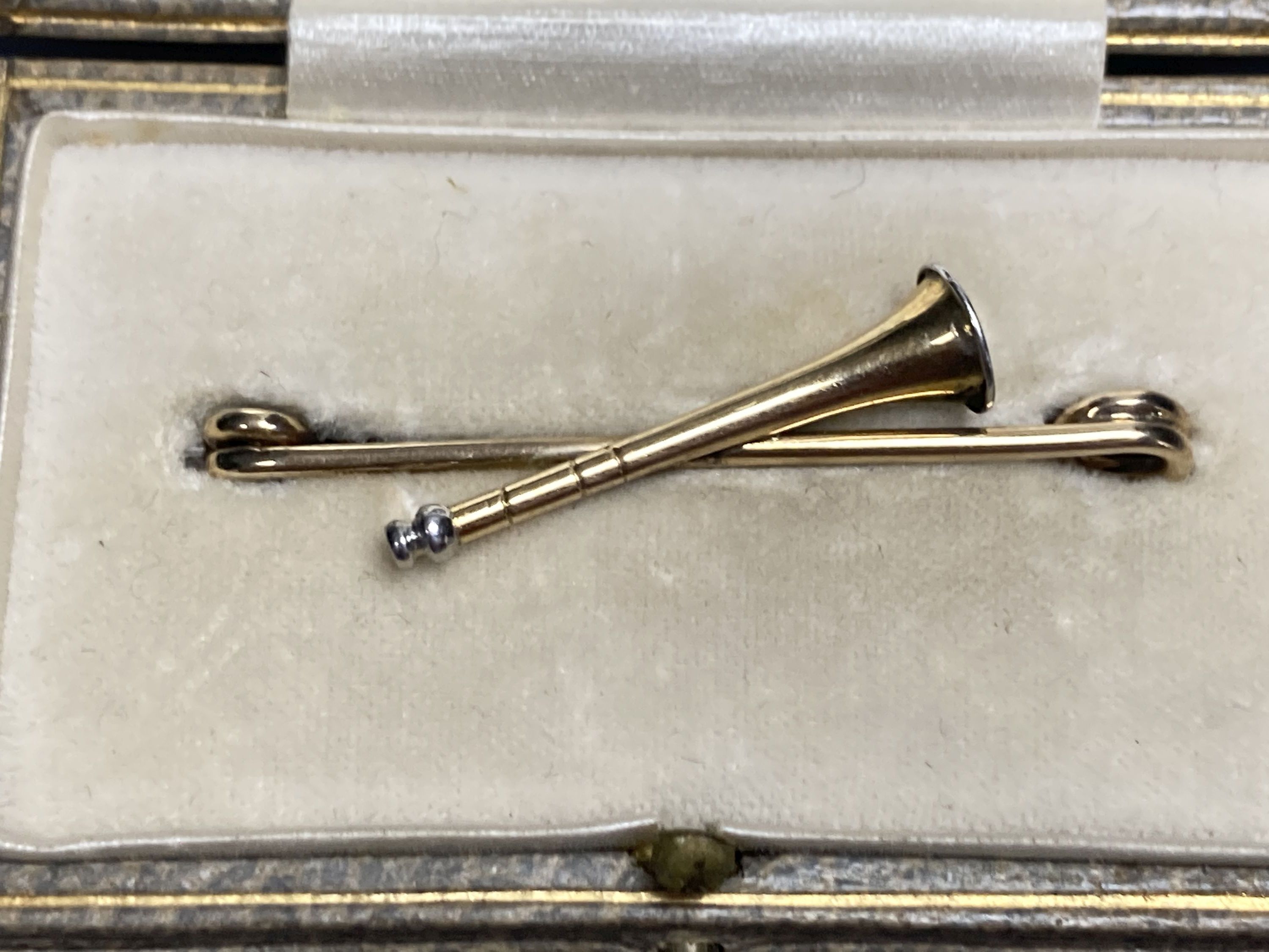 Four assorted late Victorian yellow metal stick pins and two tie pins.